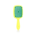 Close-up of yellow and green honeycomb hair brush with hollow grid design for styling - Yellow