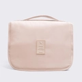 Light pink waterproof travel toiletry bag with handle and central travel logo tag - Beige