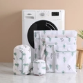 Detail view of 6-piece mesh laundry bags set with cactus print on white marble floor - 40*50cm / Cactus