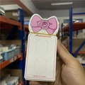 Detail of white jewelry display cards with pink bow design held in a warehouse setting - Kp175 Approximately 6*13cm Approximately 100 Sheets