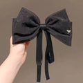 Elegant black pearlescent gauze hair clip with large bow and small metal butterfly detail - Black