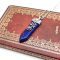 Lapis lazuli hexagonal prism pendant necklace with silver star symbols on vintage book - Lapis Lazuli