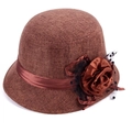 Detail of a brown linen bucket hat featuring a silk flower and black polka dot mesh veil - 58cm / Coffee