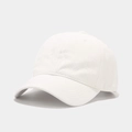 Close-up of a white cotton baseball cap showing detailed fabric texture and stitching - White