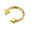 Macro shot of golden stainless steel horseshoe nose ring with sharp conical ends - Gold