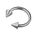 Close-up of silver stainless steel horseshoe barbell with conical spikes piercing jewelry - White