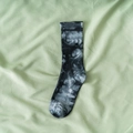 Mid-calf crew socks featuring black and grey tie-dye pattern on a ribbed cuff - One Size / Black Grey Tie Dye