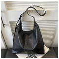 Classic black PU leather tote bag with adjustable strap and silver hardware finish - Black