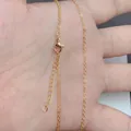 Macro shot of 18K gold plated cable chain with lobster clasp and extension link - Minimalist Fine Necklace