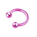 Detailed close-up of pink stainless steel U-shaped CBR body jewelry with round bead ends - Sphere / Pink