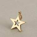 Polished gold stainless steel hollow star pendant with jump ring on a beige background - 14mm Hollow Star / Gold