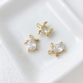 Detailed view of three 14k gold-plated turtle charms with oval cubic zirconia in ceramic tray - 6# Turtle