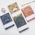 Set of four vintage magic book style hardbound notebooks in gold, red, blue, and green - A5 / Random