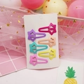 Detailed view of colorful star-shaped hair clips in pastel tones on a decorative card - Star Style