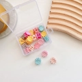 Detailed view of colorful flower mini hair claws in a transparent plastic storage box - 1-Daisy 20pcs Mixed Colors