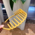 Close-up of bright yellow matte headband featuring wave-shaped non-slip inner teeth - Yellow