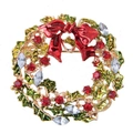 Detail of Christmas wreath brooch with red bow and sparkling rhinestones on gold alloy - Enameled Xmas Wreath