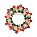 Detailed view of Christmas wreath brooch with red and green crystals in gold setting - Full Rhinestone Wreath