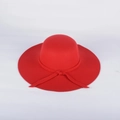 Detailed view of wide brim red wool felt hat with decorative matching bow tie - M (56-58cm) / Red