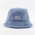 Plush lamb wool bucket hat in blue featuring a signature stitched textile patch detail - One Size / Blue