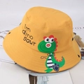 Detail view of yellow kids bucket hat with cute green cartoon dinosaur print and embroidery - Circumference 54CM for 2-8 Years / Yellow