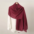 Detail of soft deep red linen scarf draped elegantly over a white shirt for women - Wine Red