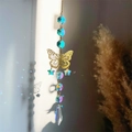Detail of hanging crystal suncatcher with golden butterfly and sparkling rainbow prisms - Gold Butterfly Colorful Beads Style (05)