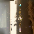 Golden crystal suncatcher with moon and star prisms reflecting colorful sunlight - Sun Geometric Pendant Style (06)