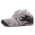 Classic cream canvas baseball cap featuring vintage newspaper print and curved brim - Khaki