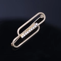 Golden paperclip brooch with crystal diamond inlay in a crossed oval geometric design - Interlocking Oval Style (YNCP04805) / Gold
