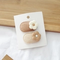 Detailed set of floral BB hair clips on display card with soft beige felt base - Flower Oval Group
