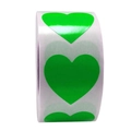 Close-up of heart-shaped green adhesive stickers in a roll with glossy finish - Green