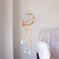 Detailed close-up of golden moon suncatcher with yellow crystals and three clear prisms - Citrine