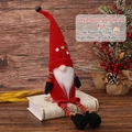 Red 55cm long-legged Christmas gnome doll with striped legs on vintage wood background - Red