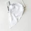 Detail view of a white satin headscarf with elastic band on a minimalist background - Satin Pure White