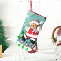 Green burlap Christmas stocking featuring a 3D plush bear and festive tree patterns - Large Dancing Bear