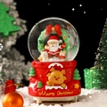 Christmas snow globe with Santa and reindeer on a red castle base with festive scene - Christmas Elk Santa (2430) / 8cm Music + Light
