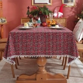Mantel navideño de cuadros rojos con flecos de pompones blancos sobre mesa de madera - 60*60cm / Cuadros rojo verde copo de nieve con bolas blancas