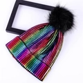 Detail of colorful rainbow striped knit beanie with large black faux fur pom-pom on top - Rainbow with Pom-pom
