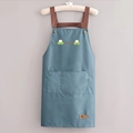 Minimalist waterproof apron in blue-grey featuring a smile print and brown straps - With Letter Print / Smoky Blue