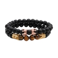 Set di bracciali in perline occhio di tigre e nero opaco con corone dorate su bianco - Set Oro Rosa