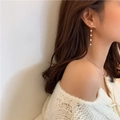 Elegant long gold chain earrings with four white pearls shown on a model side view - White (D-2-14)