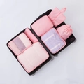 Light pink 7-piece travel organizer bag set packed inside a black suitcase - Peach Pink-7Pcs Set