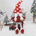 Christmas gnome doll with red polka dot hat and striped legs sitting on toy car - Red Hat Sitting Style (D-BJ46)