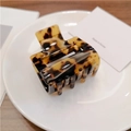 Detail view of square tortoiseshell hair claw clip with glossy acetate finish and sturdy teeth - Coffee Tortoise (5cm) / Small
