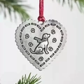 Heart-shaped metal dog ornament with red ribbon hanging on festive evergreen branch - Heart Dog Antique Silver / Antique Silver