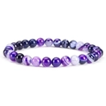 Macro shot of 6mm striped agate beads with natural purple and black stone textures - Banded Agate-1