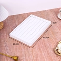 Detailed view of white jewelry display tray showing dimensions 30.1x20.3x3cm on wood desk - Medium Ring Tray