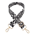 Close-up of black and white bohemian style wide shoulder strap with gold swivel hooks - Gold Buckle / Black+White