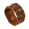 Vintage brown leather wristband with bronze studs and cross emblem on white background - Brown